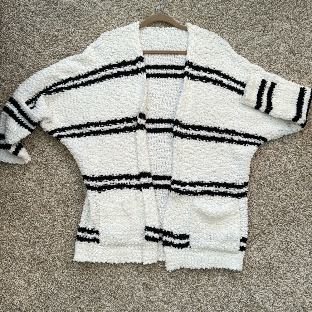 Cardigan white with black stripes.  Popcorn knit with dolman sleeves